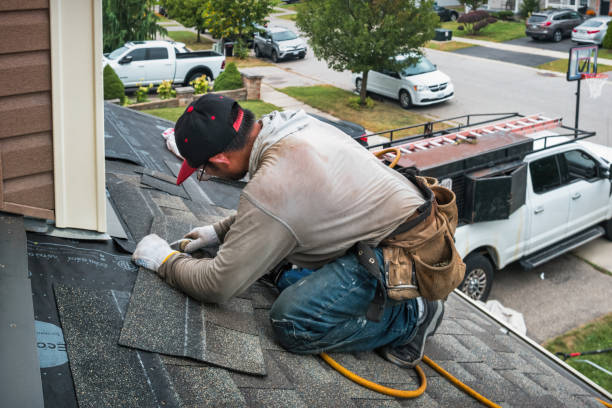 Professional Storm Damage Roof Repair technician working in Rush, NY